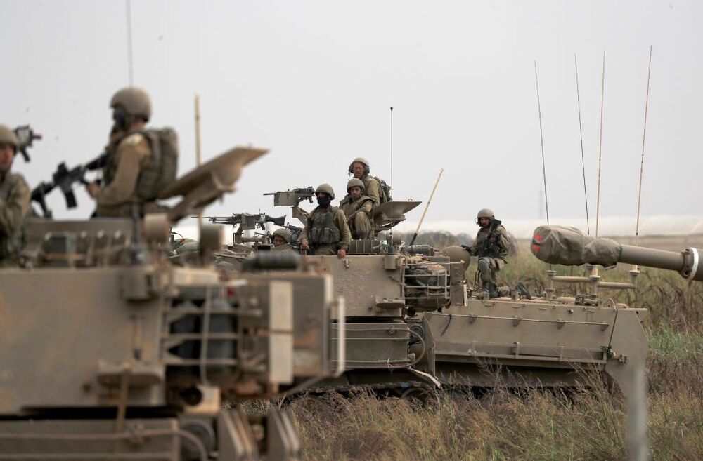 Israeli military tries to strengthen borders with Gaza as battle enters third day  / ATEF SAFADI